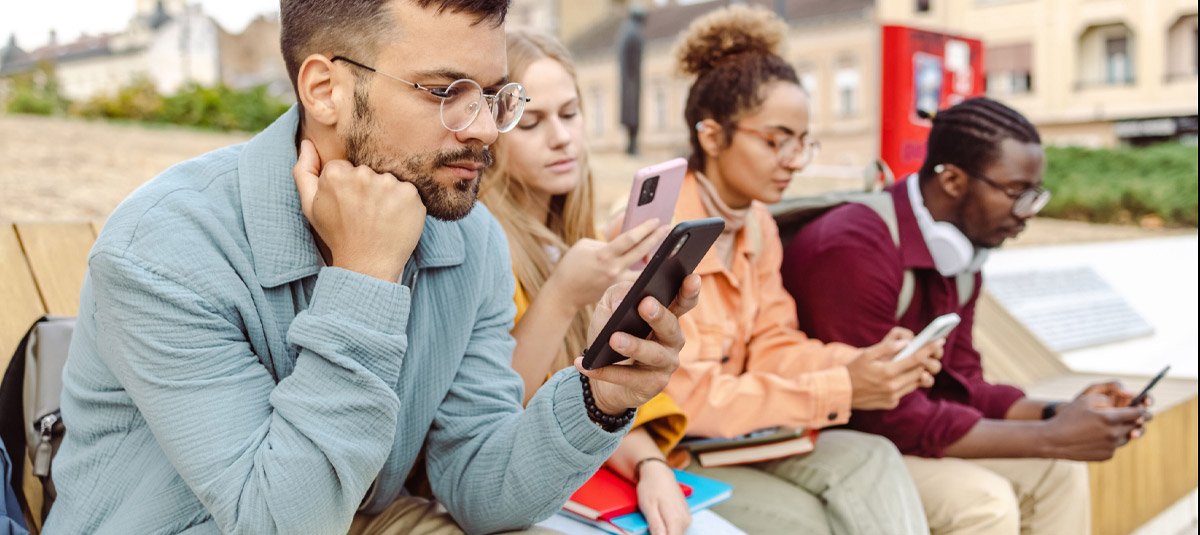 gen-z-having-phones-in-hand-all-sitting